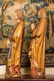 Two large Flemish polychromed and gilt walnut figures of Mary and John the Baptist, Brabant, late 15th C.