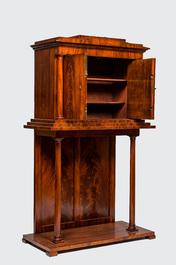 A neoclassical mahogany cabinet on stand, 19th C.