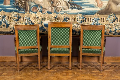 A green-upholstered carved wooden salon set with a two-seater, a fauteuil and three armchairs, 19th C.