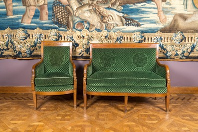 A green-upholstered carved wooden salon set with a two-seater, a fauteuil and three armchairs, 19th C.