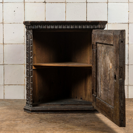 A small dark-patinated wooden corner cabinet with a shepherdess, 17th C. and later