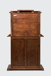 A neoclassical mahogany cabinet on stand, 19th C.