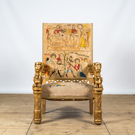 An imposing gilt wooden throne chair with griffins and woven seating in Romanesque-style, ca. 1900