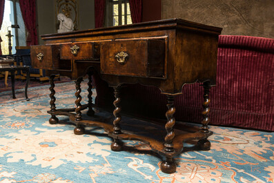 An English walnut sideboard with three drawers, 19th C.