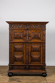 A finely sculpted Flemish oak four-door cabinet, late 17th C.