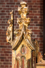 An impressive Gothic Revival carved and gilt wood frame with monks under canopies, 19th C.