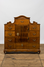 A German low ribbed wooden cabinet of drawers with a central door, 19th C.