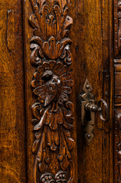 A finely sculpted Flemish oak four-door cabinet, late 17th C.