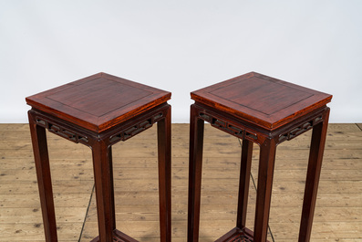 A pair of Chinese wooden square stands and two round ones with marble tops, 20th C.