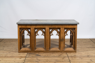 A pair of Gothic Revival oak wooden consoles with bluestone top, 19/20th C.