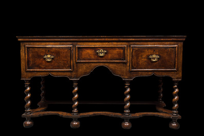 An English walnut sideboard with three drawers, 19th C.