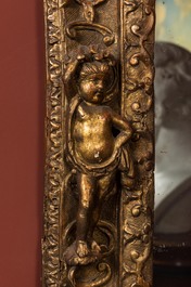 A gilt wooden baroque mirror with putti, 18th C.