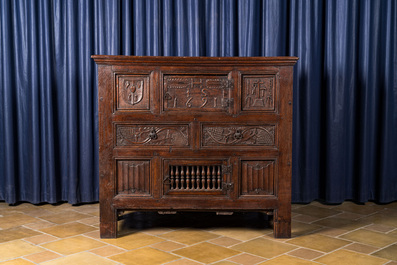 A Flemish carved oak two-door and two-drawer buffet with the Passion Instruments, dated 1691