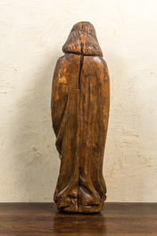 A large walnut figure of John the Baptist from a calvary, late 15th C.