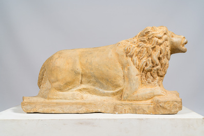 A marble model of a reclining lion, 20th C.