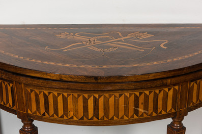 An Italian marquetry demi-lune gaming table with inlaid design of bow and arrows, 18/19th C.