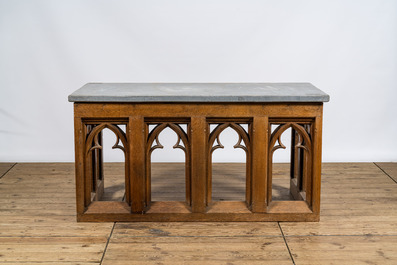 A pair of Gothic Revival oak wooden consoles with bluestone top, 19/20th C.