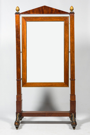 A large French mahogany Empire psych&eacute; or cheval dressing mirror, 19th C.