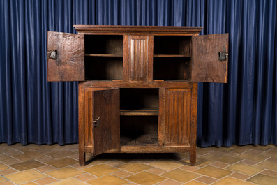 A Flemish oak three-door cupboard with carved panels, 16th C.