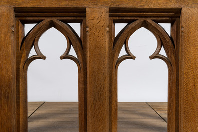 A pair of Gothic Revival oak wooden consoles with bluestone top, 19/20th C.