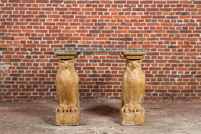 A console composed of a green marble top resting on two resin falcon-shaped supports, 20th C.