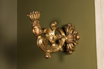 A pair of gilt wooden wall appliques with crowned cherubs, 18th C.