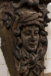 A patinated concrete wall console with mascaron, 20th C.