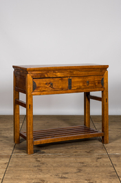 A Chinese wooden console with two drawers, 20th C.