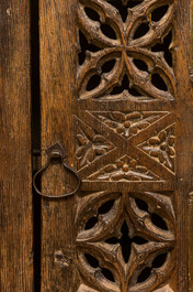 An English Gothic-style carved oak hanging cupboard composed of old elements, 17th C. and later