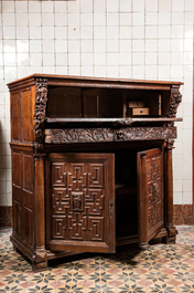 A Flemish oak 'columns' cupboard, 17th C. with later elements