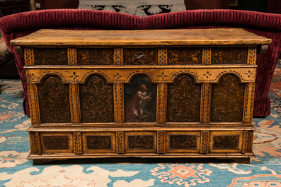 A large wooden chest with painted panels and leather upholstery, 17/18th C.