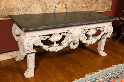 A pair of imposing white patinated consoles with a central mascaron and bluestone top, 19/20th C.