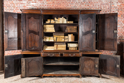 A large French oak two-part cupboard with eight doors and two drawers, Lorraine region, 18th C.