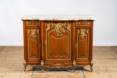 A pair of marble-topped partly gilded wooden side cabinets, 19/20th C.