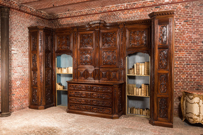 An imposing walnut sacristy cupboard with floral design and garlands, 18th C.