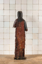 A large polychromed carved wooden folk art figure of a female saint, North of France, probably 16th C.