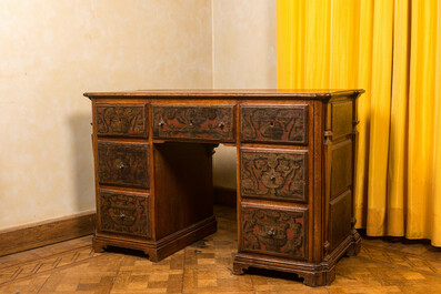 A wooden desk with six drawers with painted panels, 19th C.