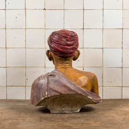 A polychrome plaster bust of an Indian wearing a turban, illegibly signed, dated 1925