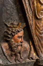 A Spanish polychrome oak panel with Catharine of Alexandria and emperor Maxentius, 17th C.