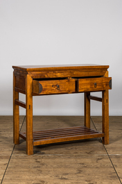 A Chinese wooden console with two drawers, 20th C.