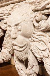 A pair of imposing white patinated consoles with a central mascaron and bluestone top, 19/20th C.