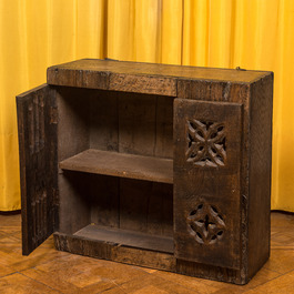 An English Gothic-style carved oak hanging cupboard composed of old elements, 17th C. and later