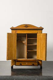 A miniature pine wood two-door cupboard, 19th C.