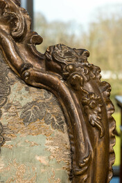 An Italian gilt carved wooden Louis XV armchair upholstered with silver brocade, 18th C.