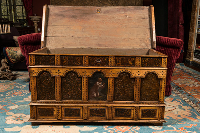 A large wooden chest with painted panels and leather upholstery, 17/18th C.