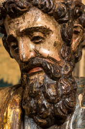 A Spanish polychromed walnut sculpture of Saint Luke, 16th C.