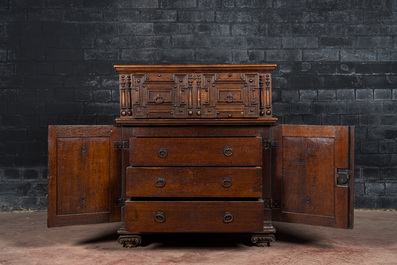 An English Jacobean style carved oak cabinet with two doors beneath a drawer, 17th C. and later