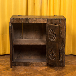 An English Gothic-style carved oak hanging cupboard composed of old elements, 17th C. and later