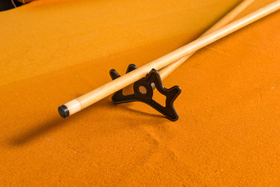 A burl wood veneered billiard table with accompanying lighting and cue holder, 20th C.