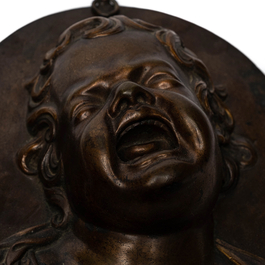 After Louis-Fran&ccedil;ois Roubiliac (1702/05-1762): A pair of bronze plaques depicting 'The laughing child' and 'The crying child', 19th C.